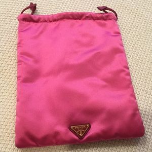 Hot pink Prada makeup bag.